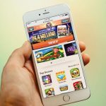hand holding a mobile device showcasing a casino app.