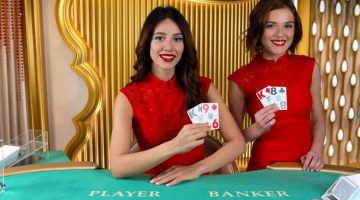 Two brunette live baccarat dealers