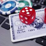 credit card play chips and dice on a laptop image