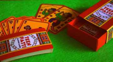 teen patti card deck on green felt