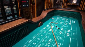 image of a craps table showing the felt and bet options.
