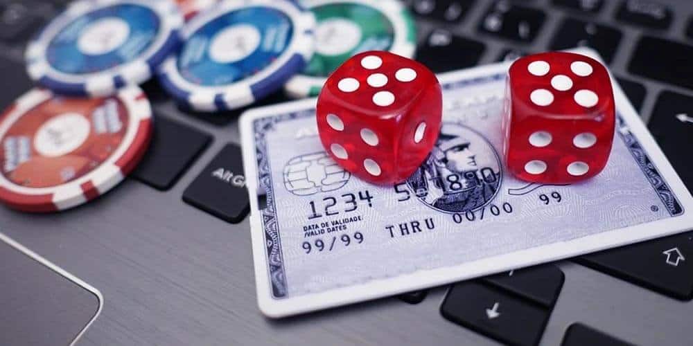 credit card play chips and dice on a laptop image