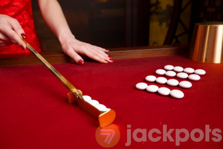 image of fan tan table with beads and stick