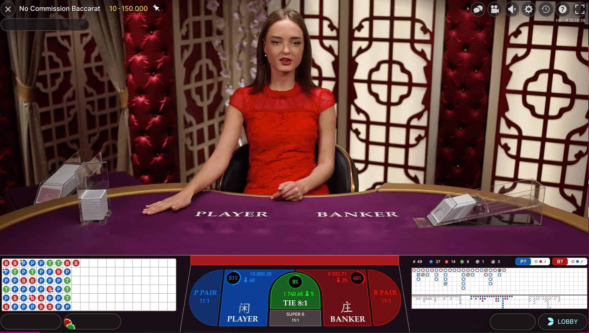 live dealer at baccarat table with road interface.